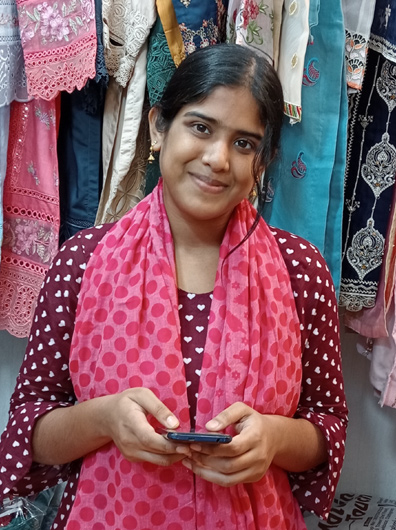 Asian lady seller holding her handphone